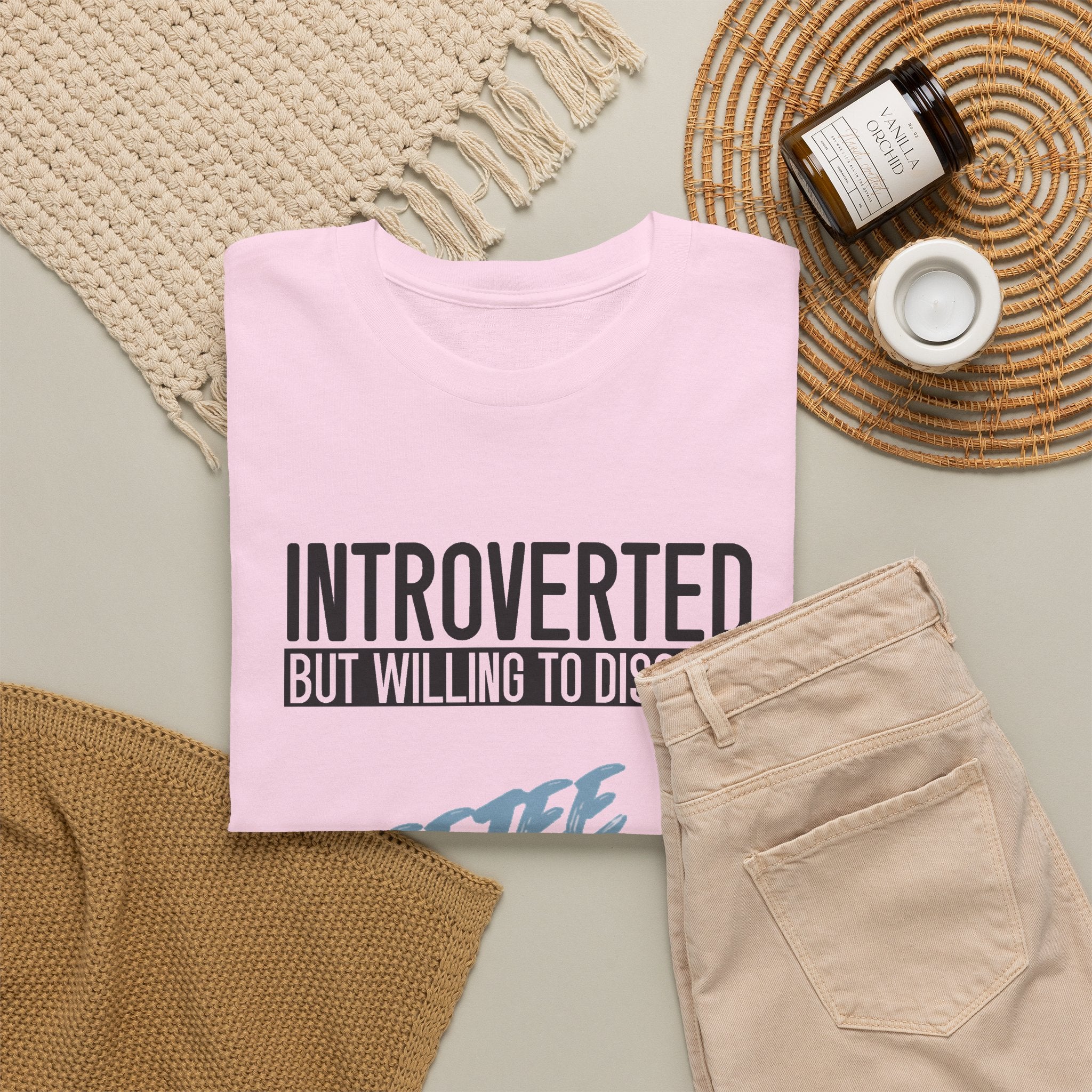 Light Pink Introverted TeeteePor slogan tee, flat-lay styled with neutral props