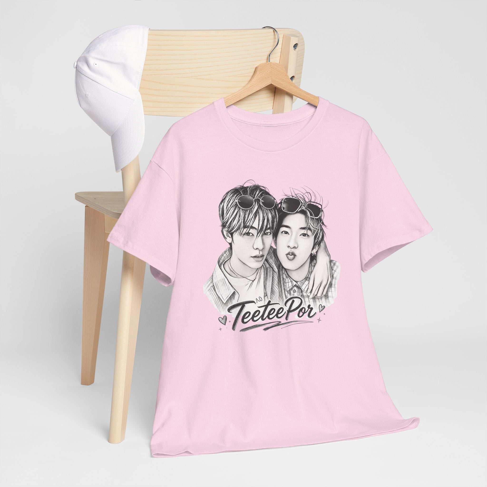 Folded light pink TeeteePor sketch t-shirt, front view — TeeTee and Por, Duang With You Thai BL fan merch