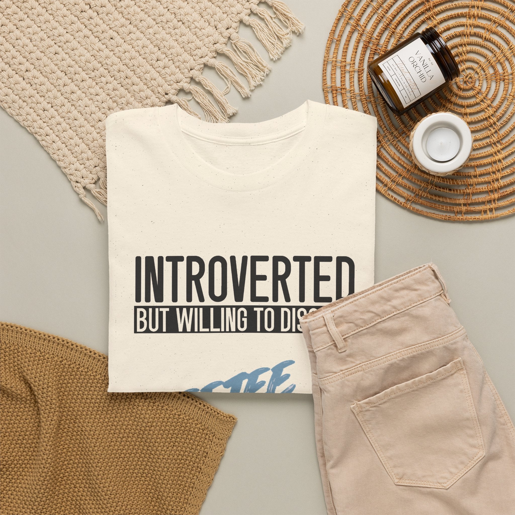 Natural Introverted TeeteePor slogan tee, flat-lay styled with neutral props