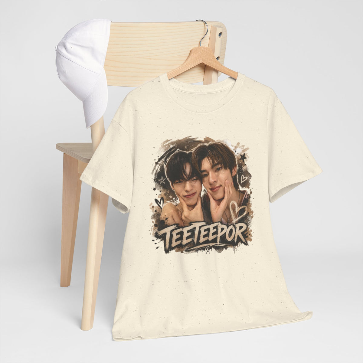 Folded natural TeeteePor graffiti t-shirt, front view — TeeTee and Por, Duang With You Thai BL fan merch
