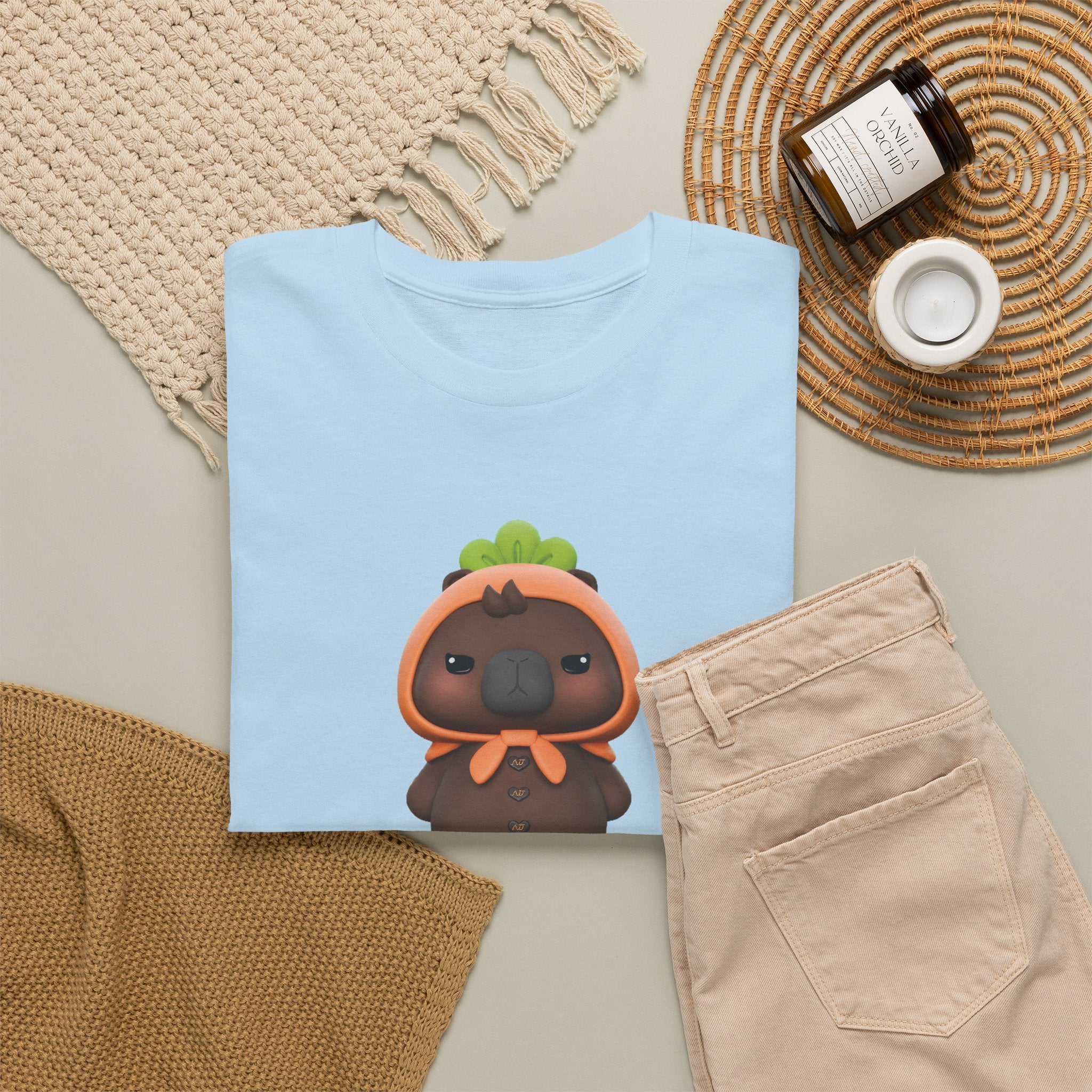 Light blue NetJJ JookKroo mascot t-shirt styled flat with chinos and coffee — Thai BL fan merch