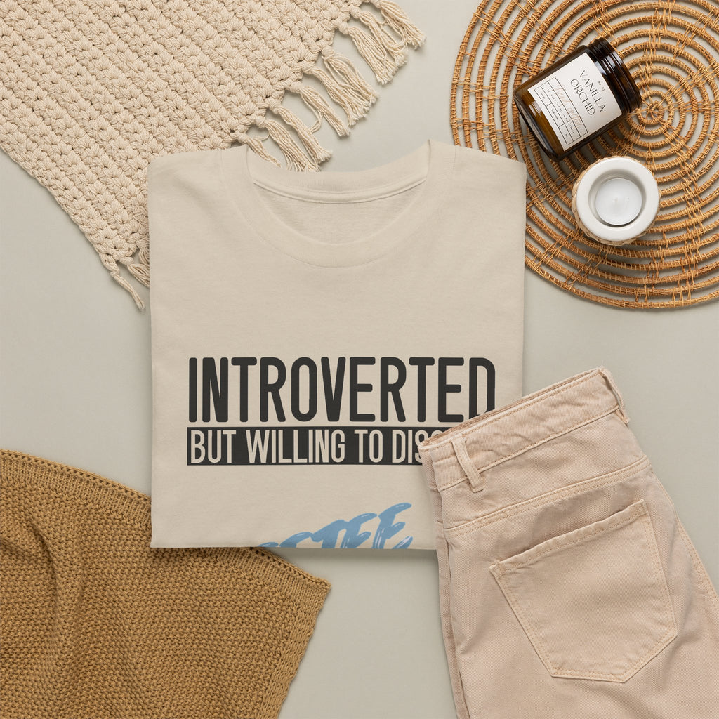 Sand Introverted TeeteePor slogan tee, flat-lay styled with neutral props