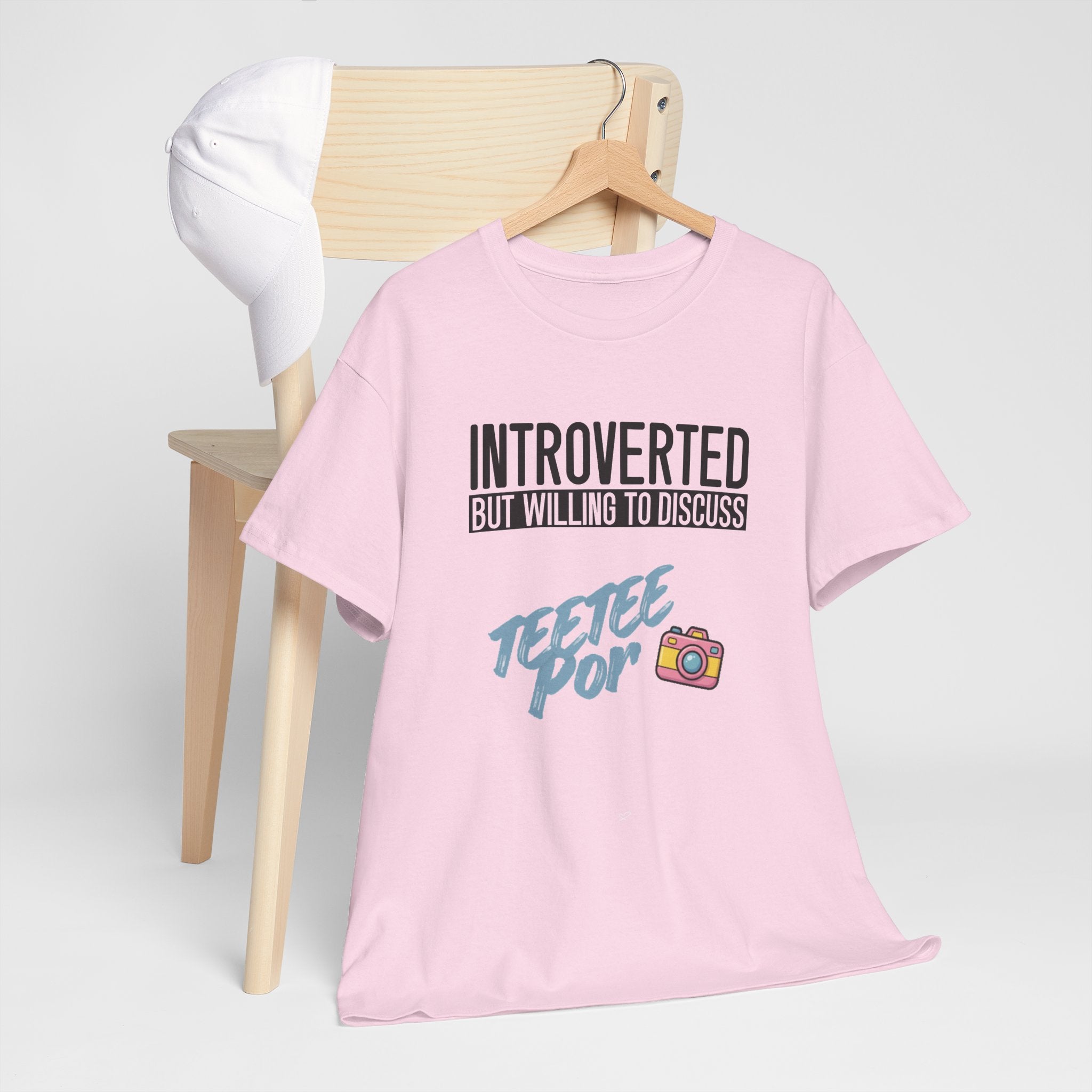 Light Pink Introverted TeeteePor slogan tee displayed on a wooden hanger