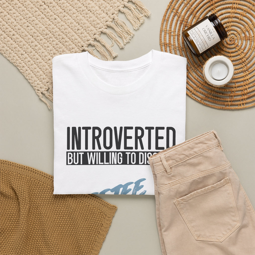 White Introverted TeeteePor slogan tee, flat-lay styled with neutral props