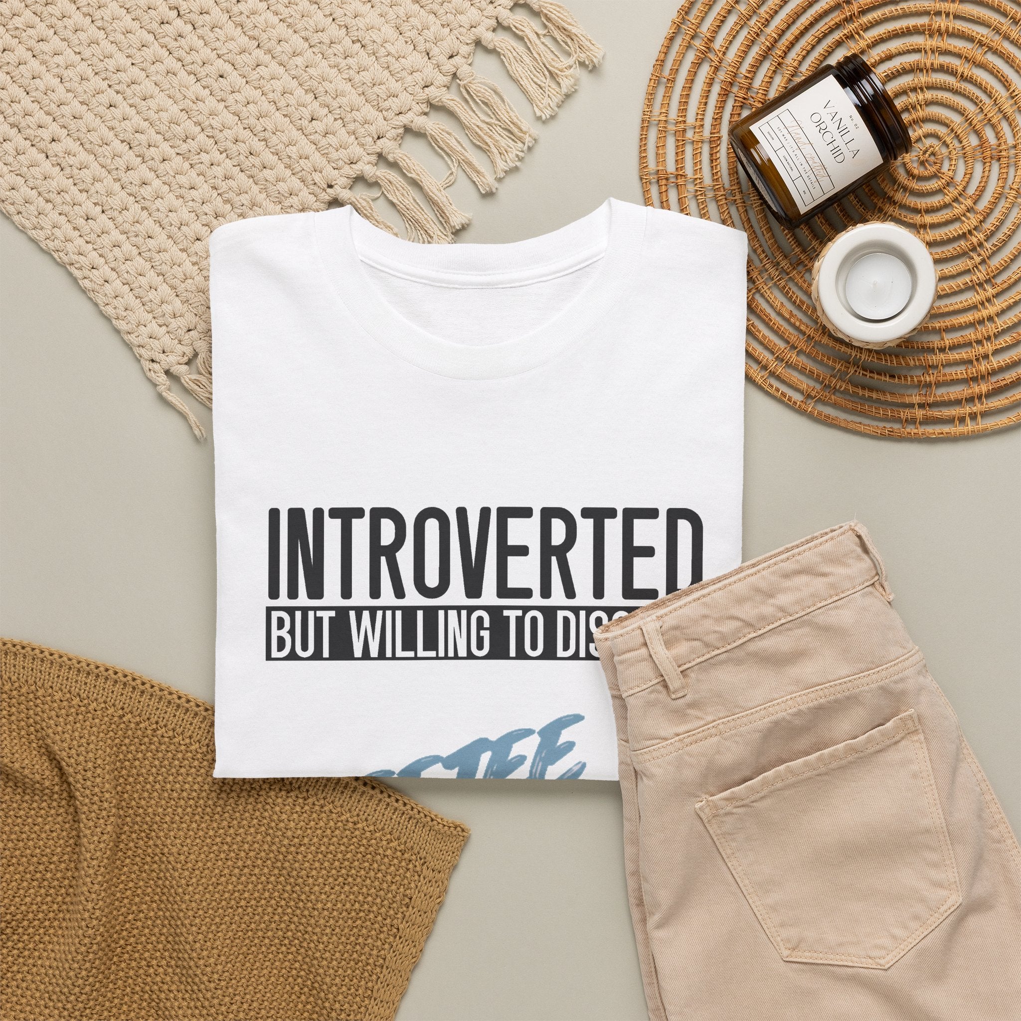 White Introverted TeeteePor slogan tee, flat-lay styled with neutral props