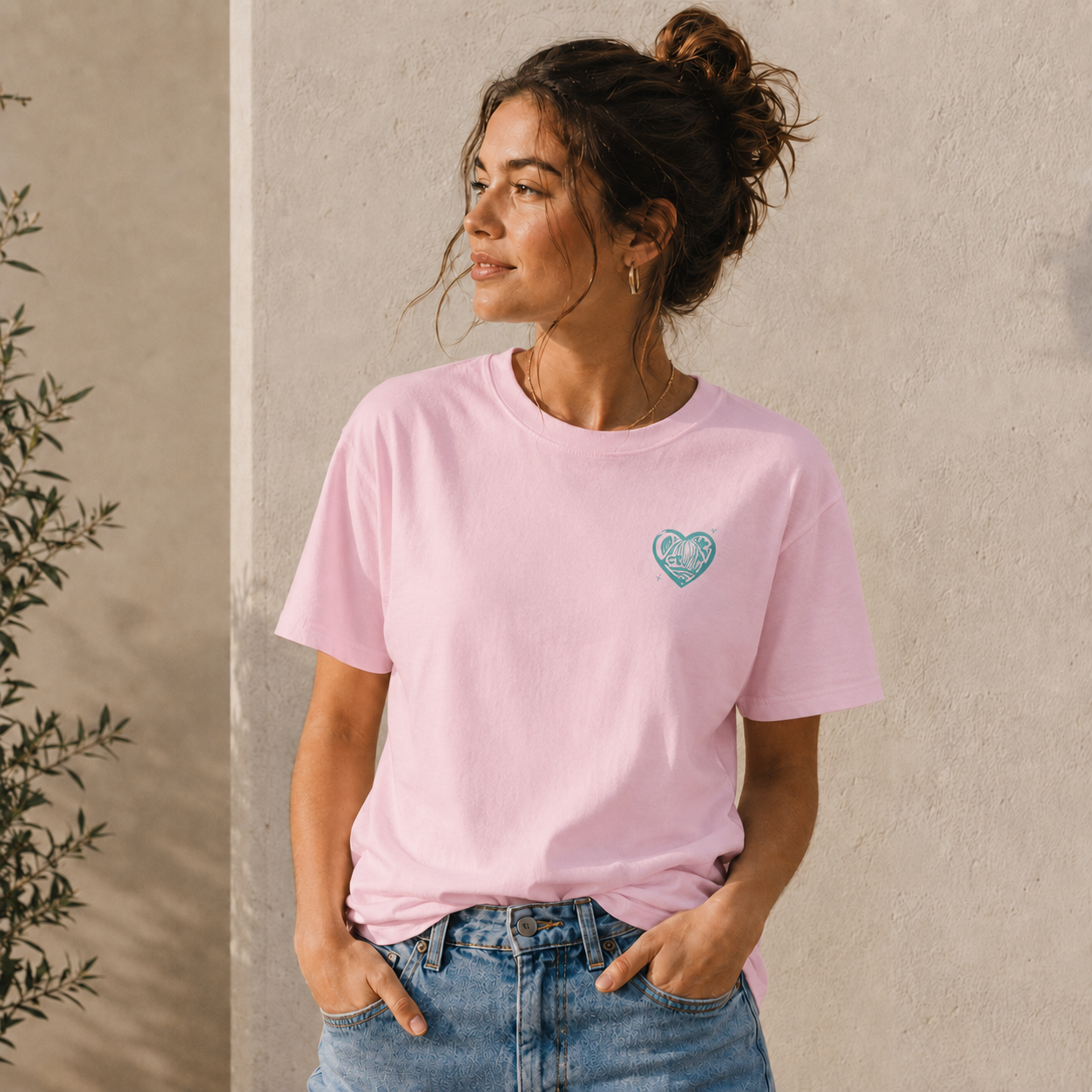 Model wearing the light pink Duang With You t-shirt with mint heart chest print — TeeteePor Thai BL fan merch